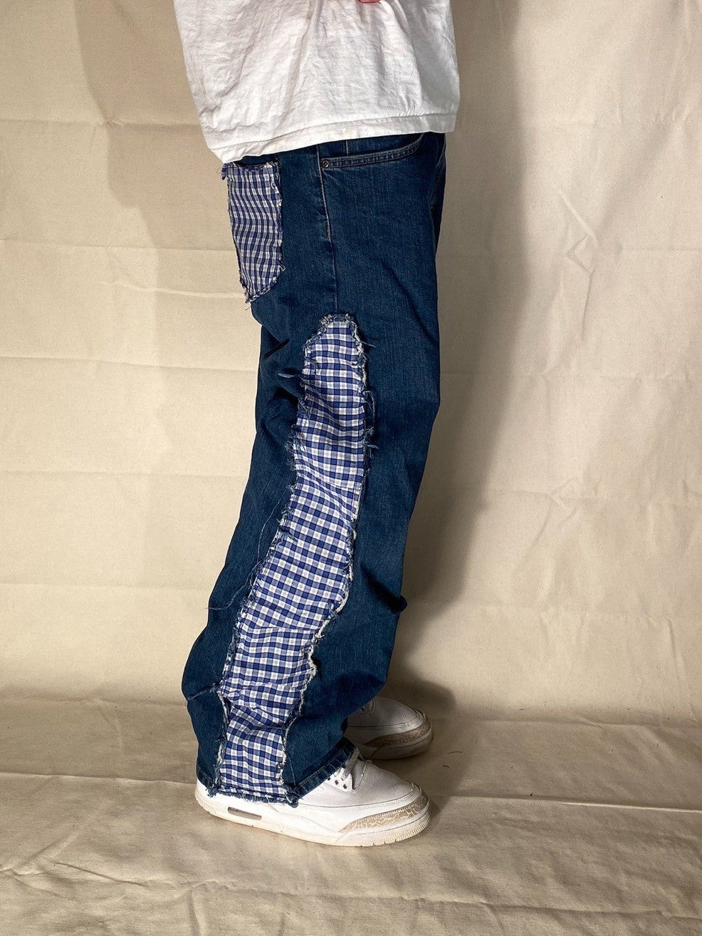 Reworked distressed plaid denim